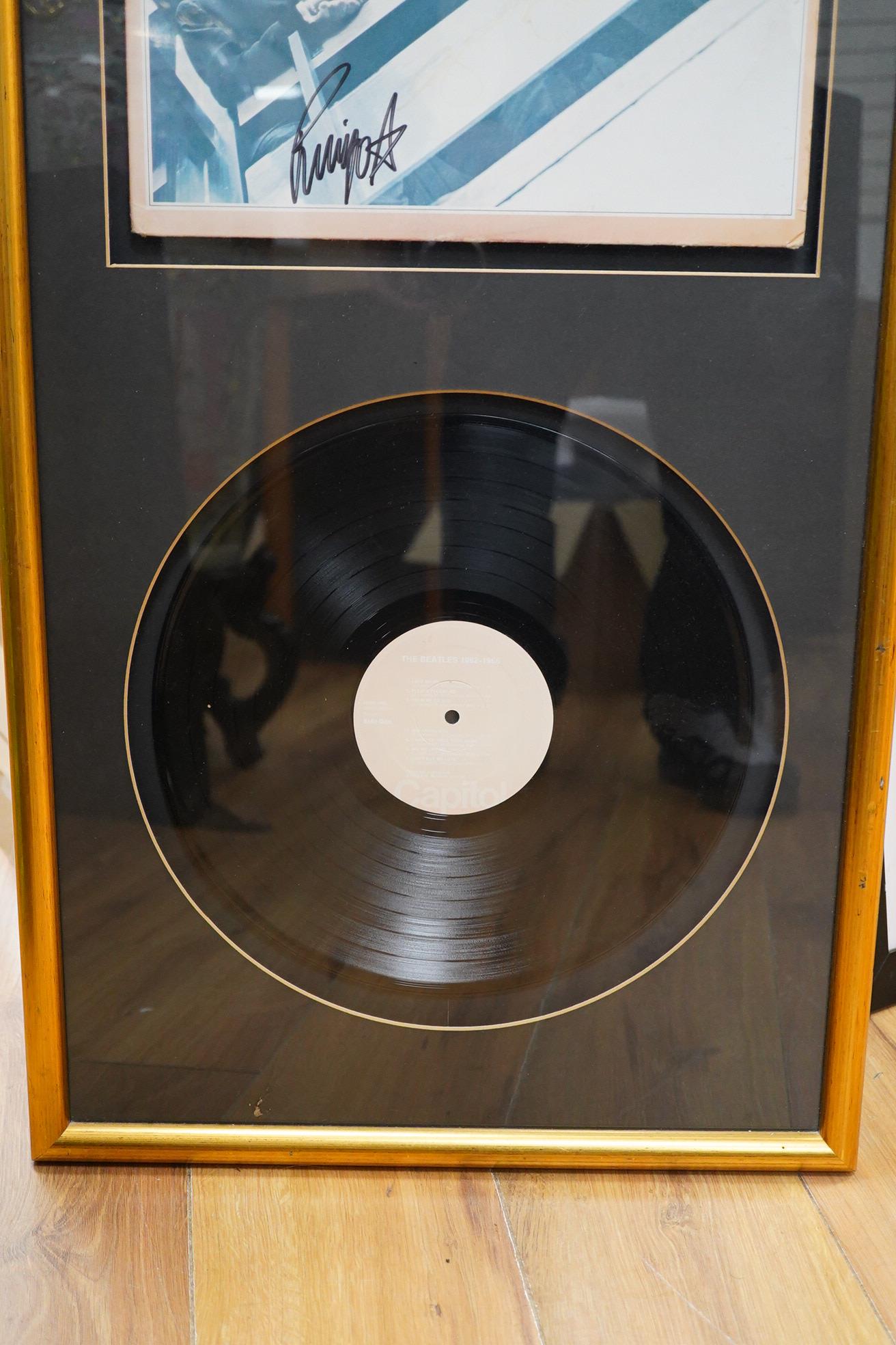 Three framed Beatles autographs; a framed signed album (missing Lennon), 84 x 44cm overall a photograph of Paul McCartney and a photograph of Ringo Starr, both signed across the image